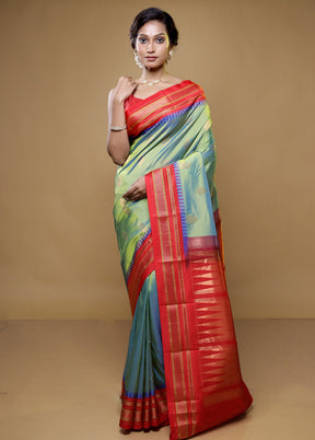 Green Kanjivaram Silk Saree With Blouse Piece