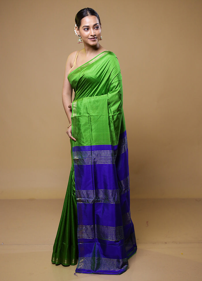 Green Kalakshetra Kanjivaram Silk Saree With Blouse Piece