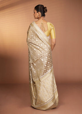 Cream Tissue Silk Saree With Blouse Piece