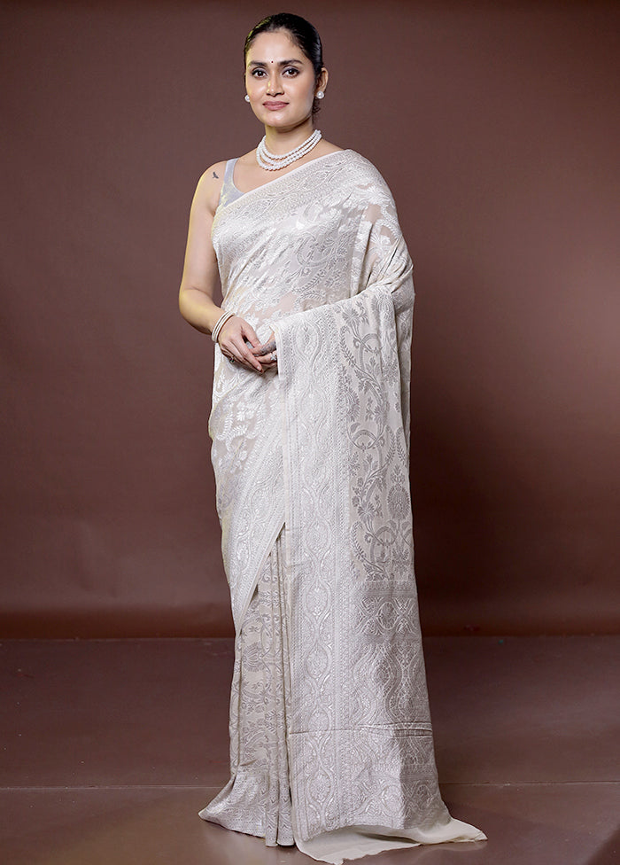 White Handloom Pure Georgette Saree With Blouse Piece