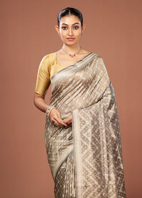 Cream Tissue Silk Saree With Blouse Piece