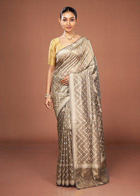 Cream Tissue Silk Saree With Blouse Piece
