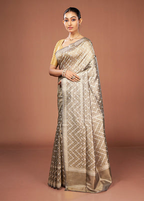 Cream Tissue Silk Saree With Blouse Piece