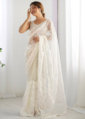 Cream Net Net Saree With Blouse Piece