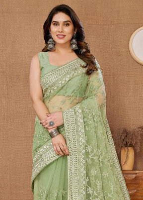 Pista Green Net Saree With Blouse Piece