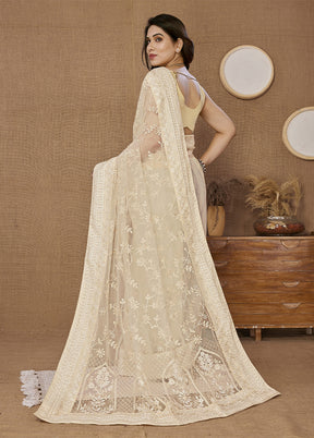 Cream Net Net Saree With Blouse Piece