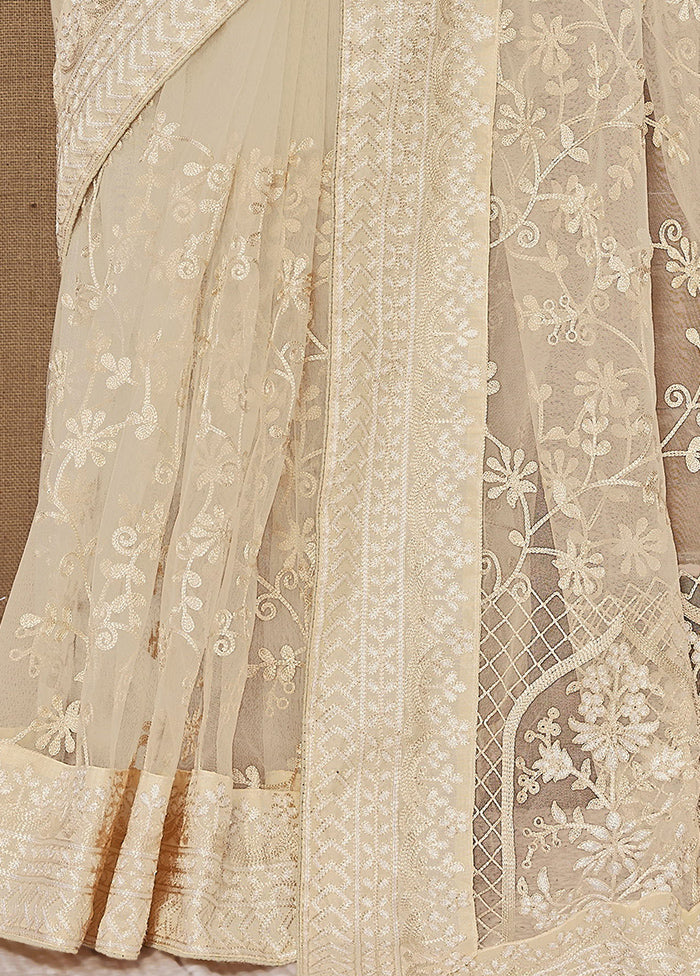 Cream Net Net Saree With Blouse Piece