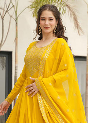 Golden Woven Work Silk Gown With Dupatta