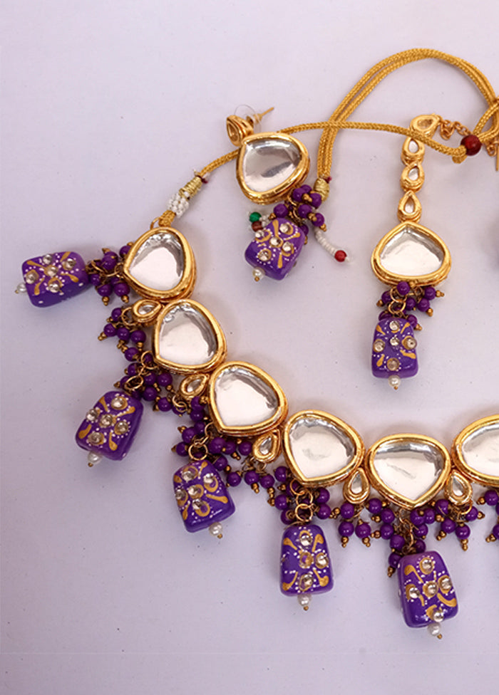 Kundan Studded Purple Jewellery Set With Mangtika