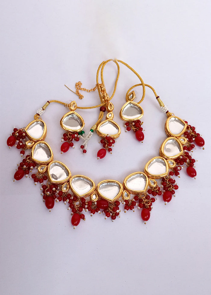 Kundan Studded Red Jewellery Set With Mangtika